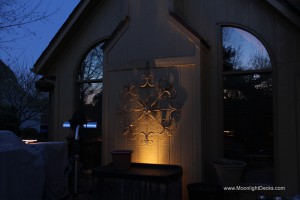 Low voltage deck lighting with lighted post caps and step lights.