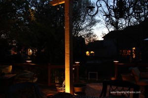 Low voltage deck lighting with lighted post caps and step lights.