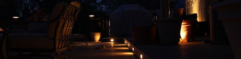 Low voltage deck lighting with lighted post caps and step lights.