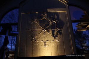 Low voltage deck lighting with lighted post caps and step lights.