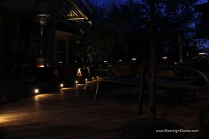 Low voltage deck lighting with lighted post caps and step lights.