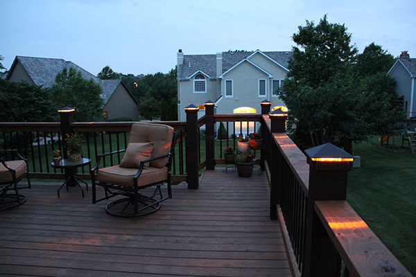 Deck lights, deck lighting, low voltage lighted post caps at night.