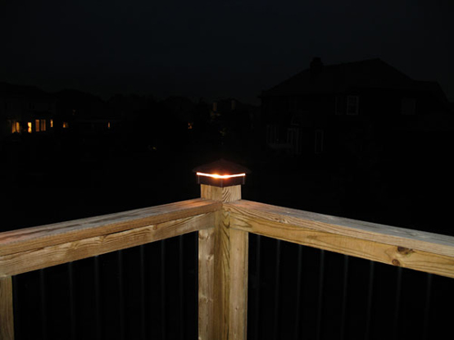 Hammered Deck Light / Lighted Post Cap at night.