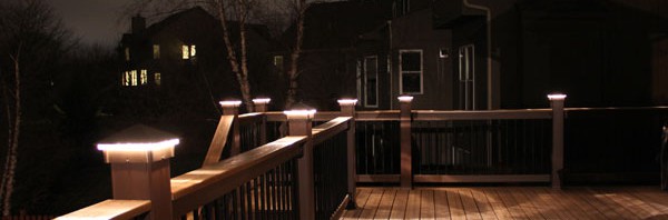 Deck lights, deck lighting, low voltage lighted post caps at night.