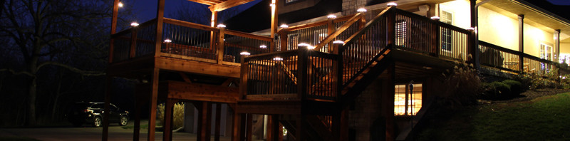 Deck lighting with low voltage lighted post caps / deck lights.