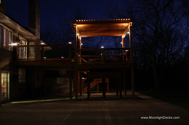 Deck lighting with low voltage lighted post caps / deck lights.
