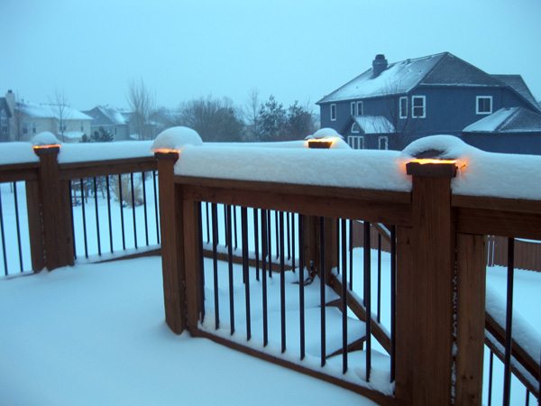 Low profile deck lights in the snow.
