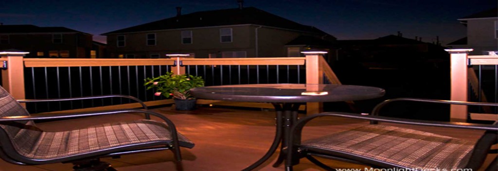Low voltage deck lighting with lighted post caps.
