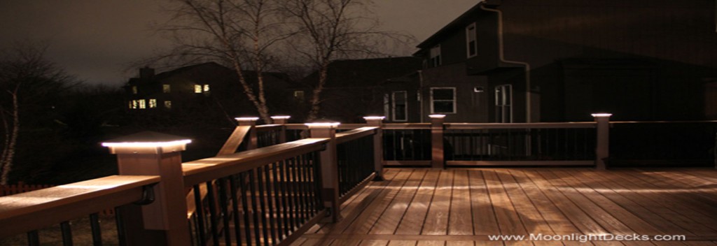 Low voltage deck lighting with lighted post caps.