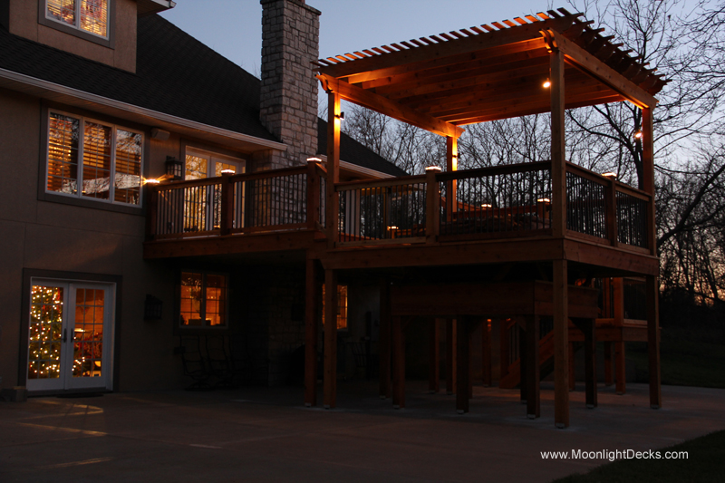 Deck lighting with low voltage lighted post caps / deck lights.
