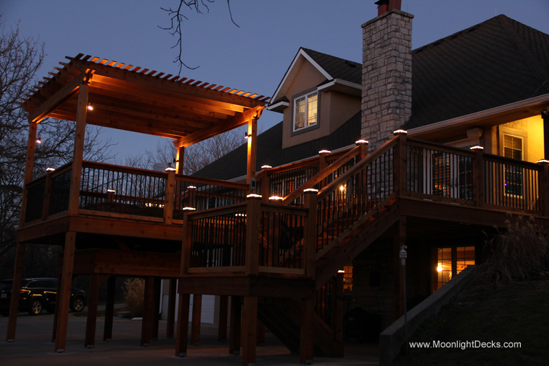 Deck lighting with low voltage lighted post caps / deck lights.