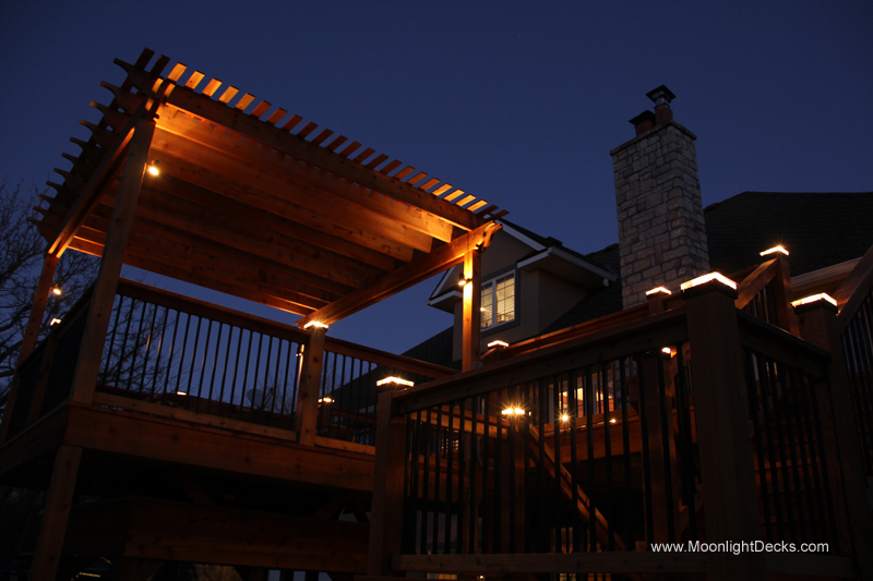 Deck lighting with low voltage lighted post caps / deck lights.