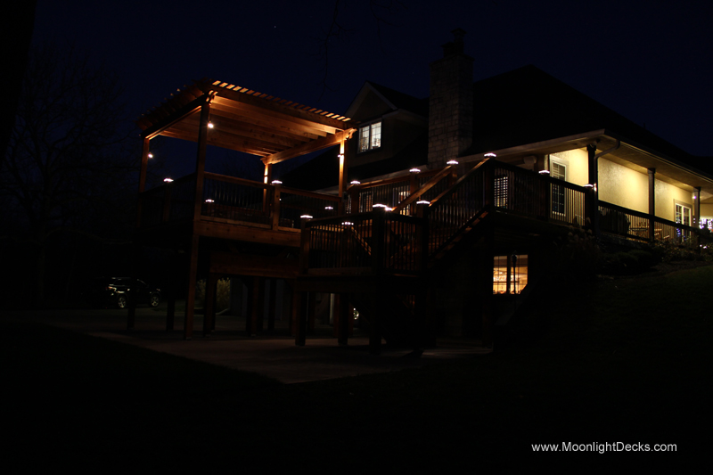 Deck lighting with low voltage lighted post caps / deck lights.
