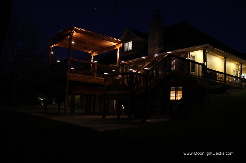 Deck lighting with low voltage lighted post caps / deck lights.