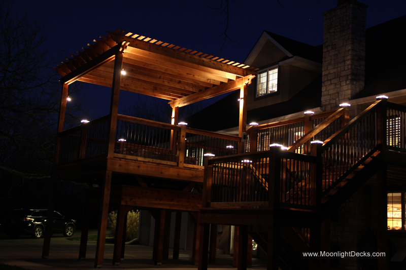 Deck lighting with low voltage lighted post caps / deck lights.