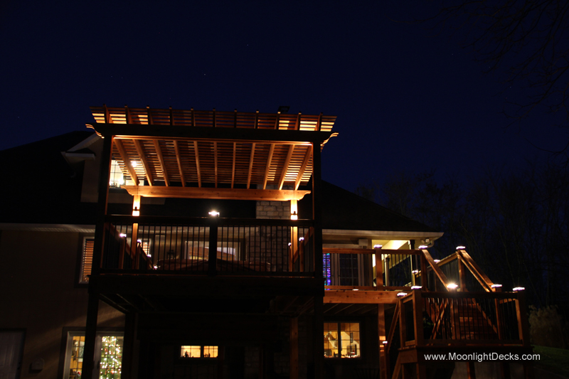 Deck lighting with low voltage lighted post caps / deck lights.