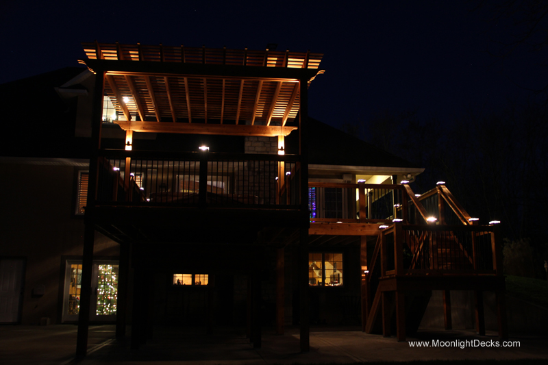 Deck lighting with low voltage lighted post caps / deck lights.