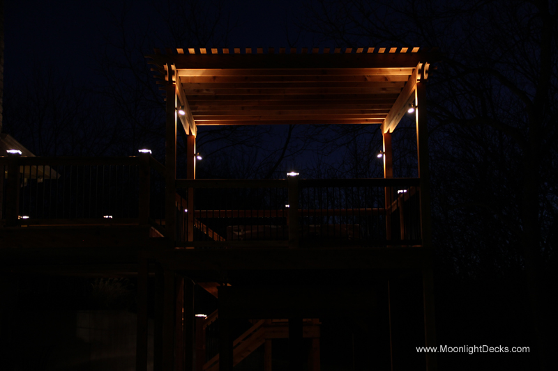 Deck lighting with low voltage lighted post caps / deck lights.